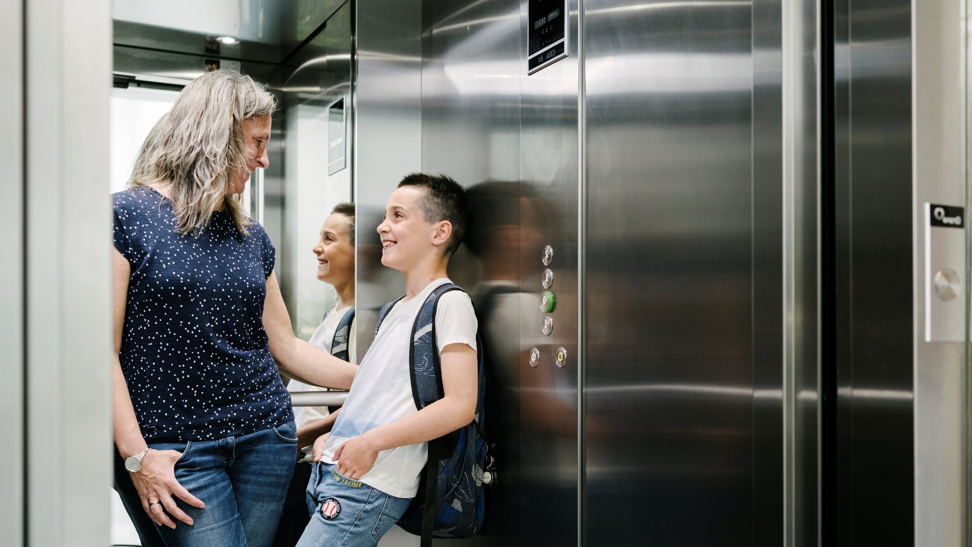 Mother with son in an Orona elevator